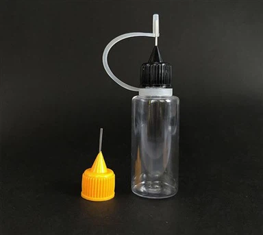 Neulakärkinen puristuspullo